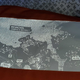 A photo shows the jacket's back reflector panel, which depicts a map of Revachol's Jamrock District where the game takes place.